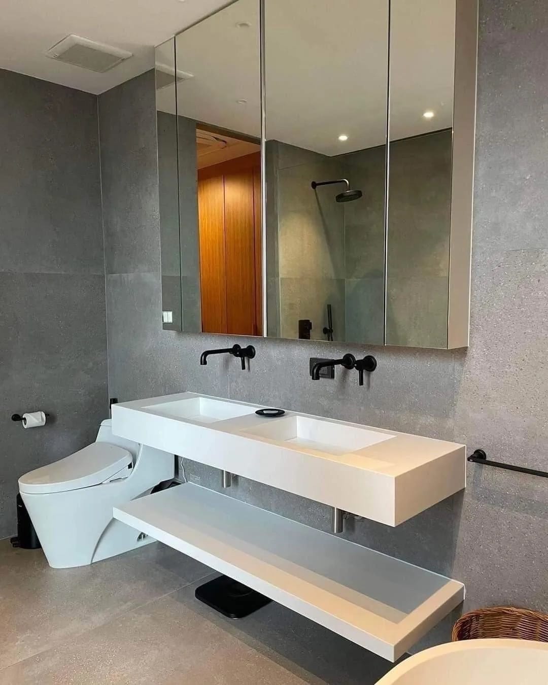 Wall-hung solid-surface vanity with an integrated basin