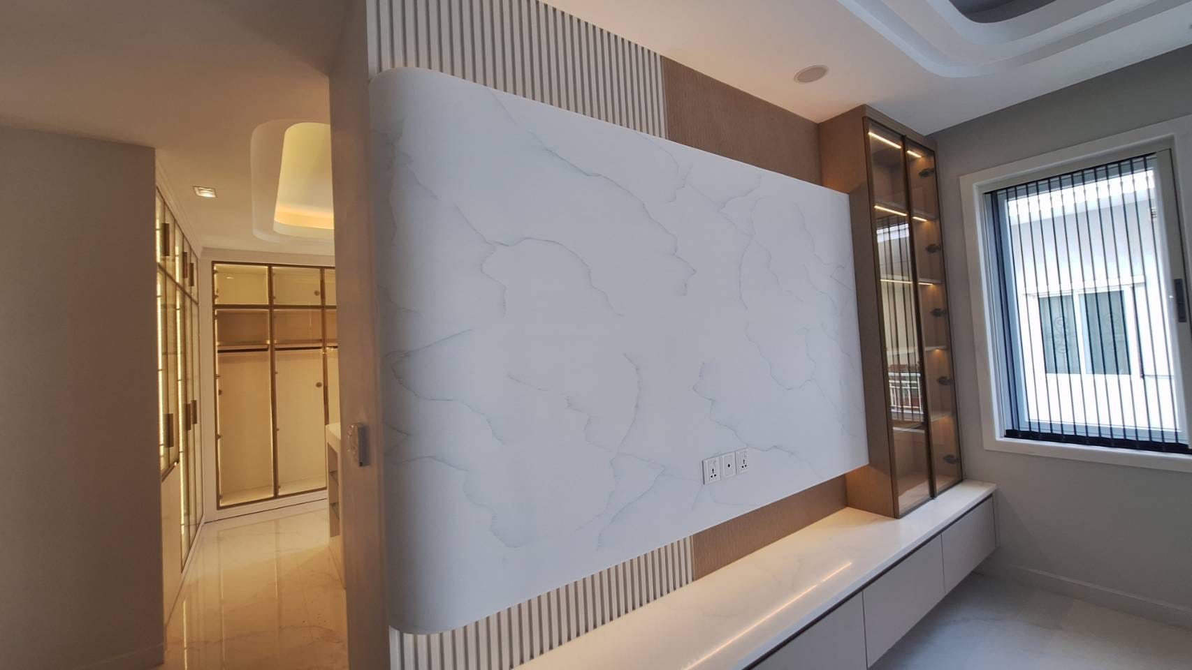 A curved veined wall panel in a residential living room