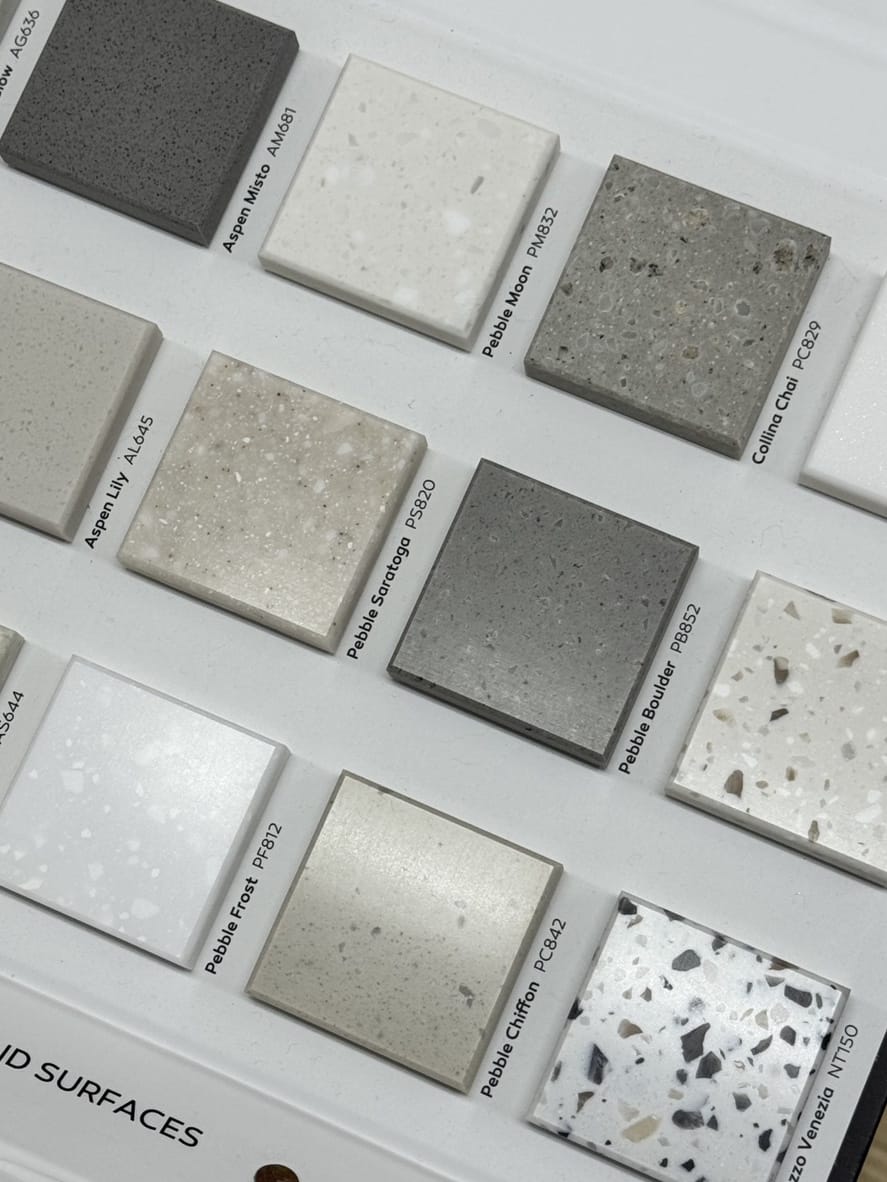 Solid-surface sample chips laid out on a board
